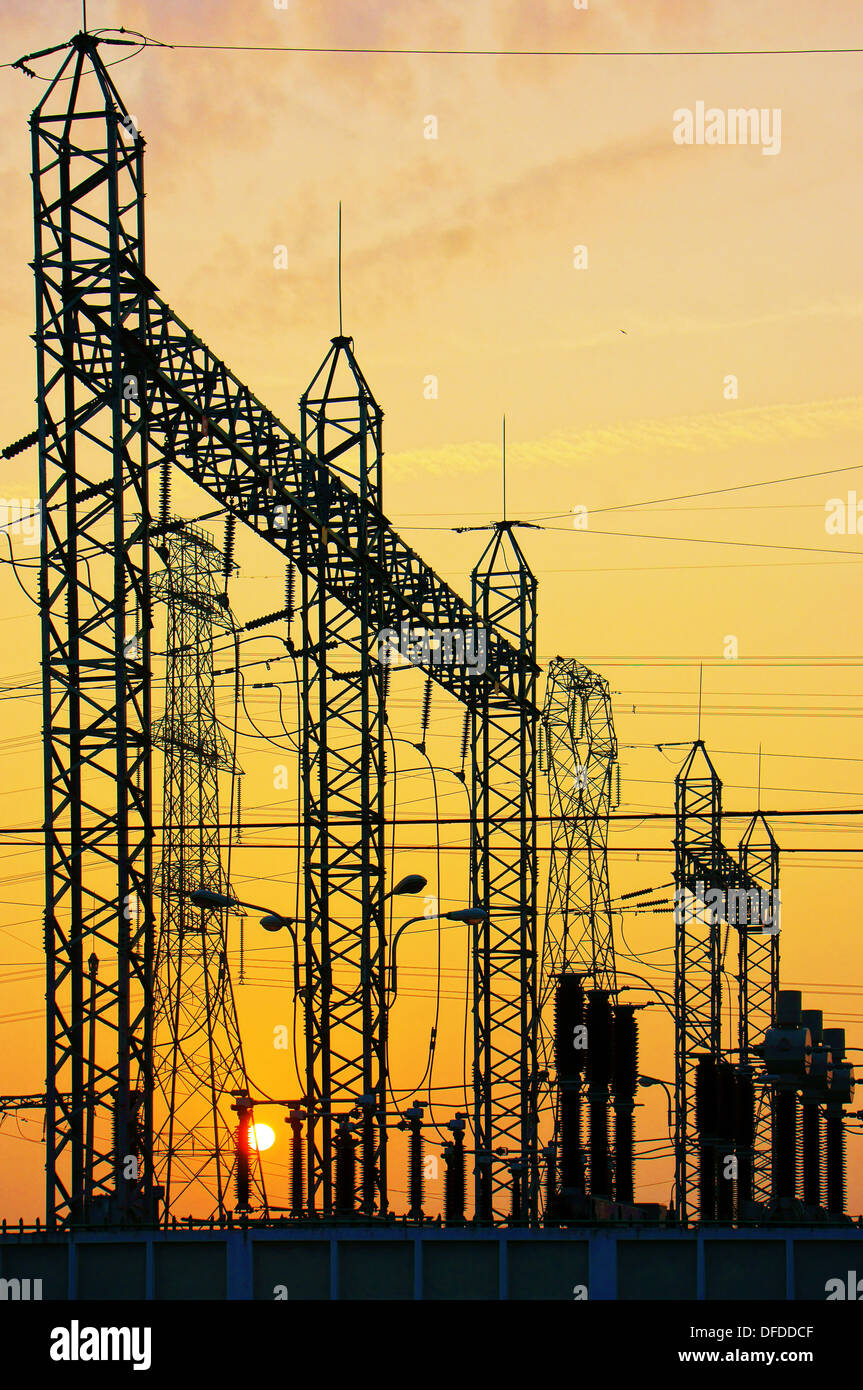 Electricity network at transformer station in sunrise, hdr Stock Photo