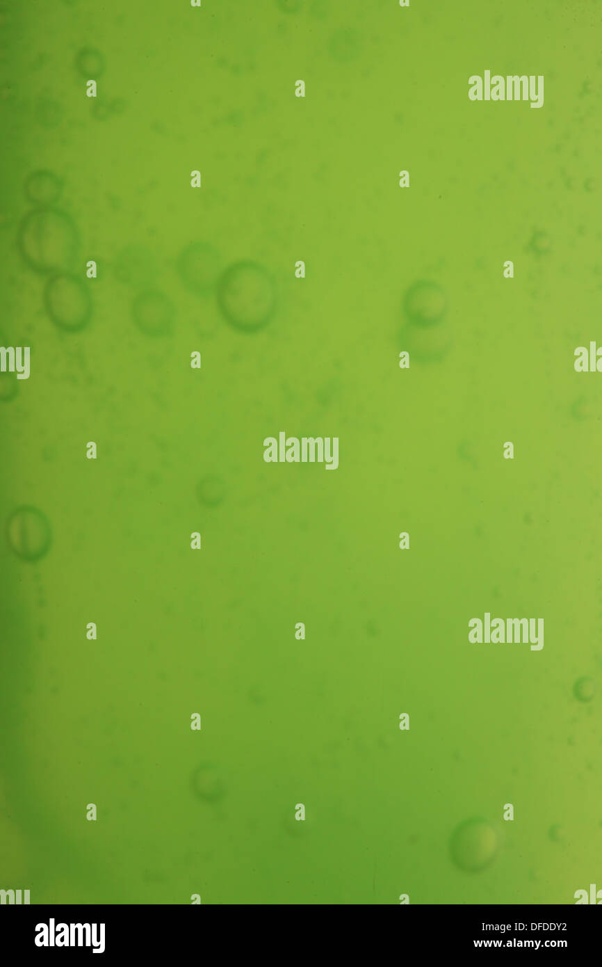 Green abstract blurred liquid background with soap bubbles Stock Photo ...