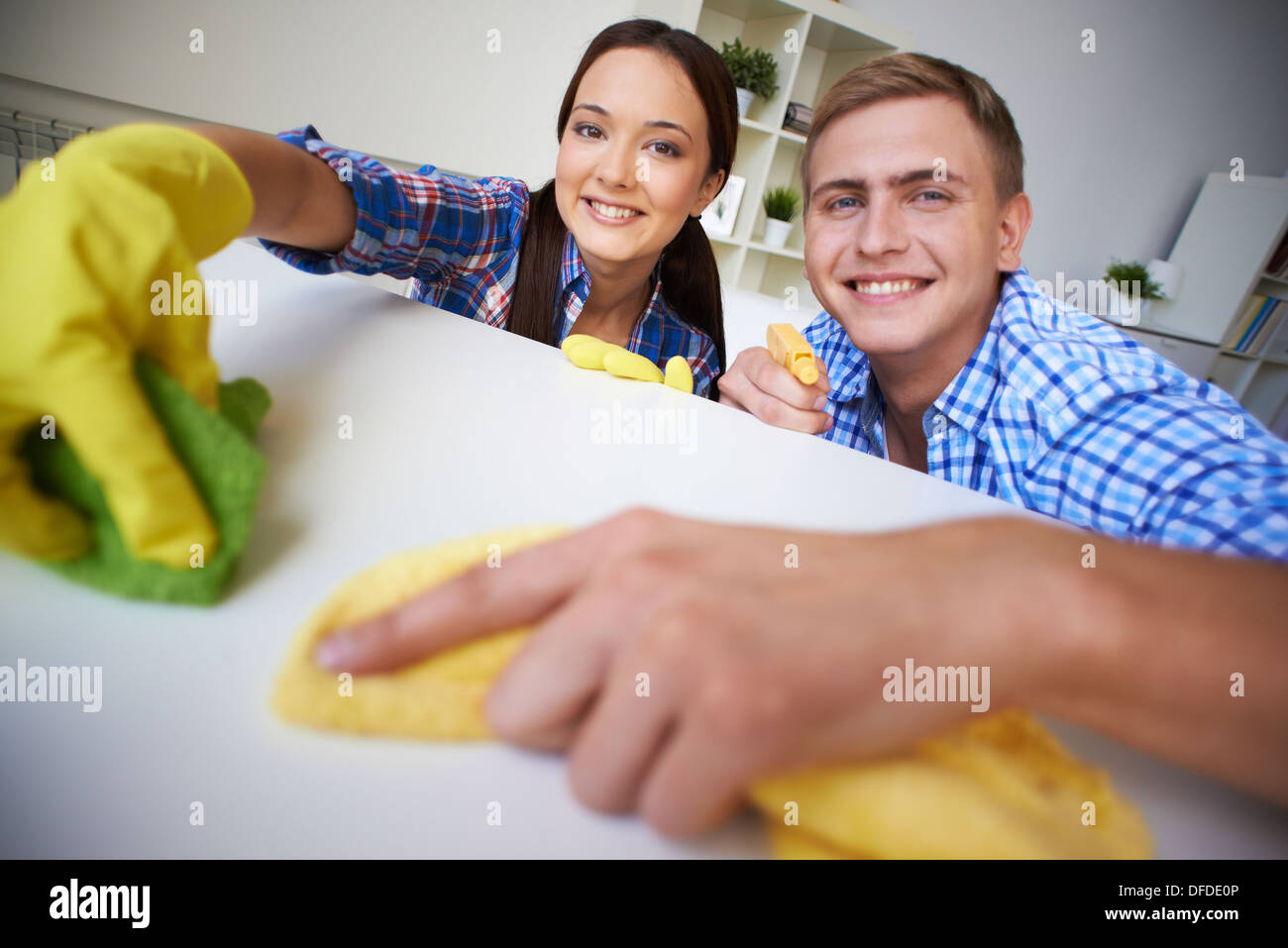 Young couple dusting at home Stock Photo Alamy