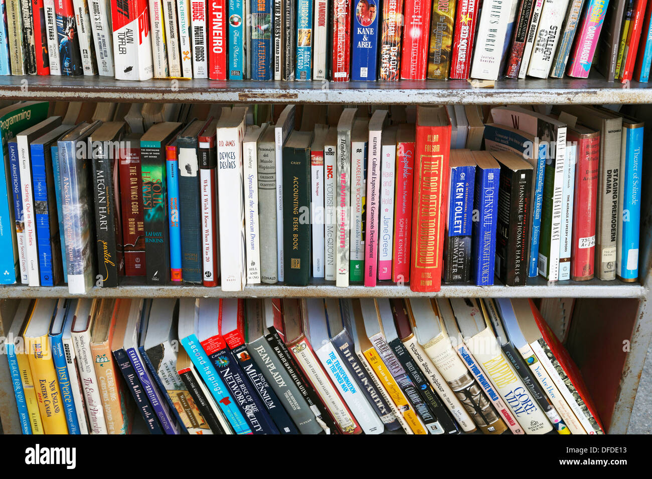 Used books in a bookshelf outside a used book store. Stock Photo