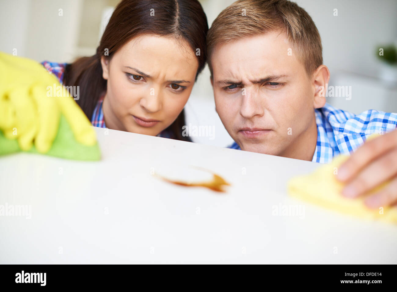Young couple dusting at home Stock Photo Alamy