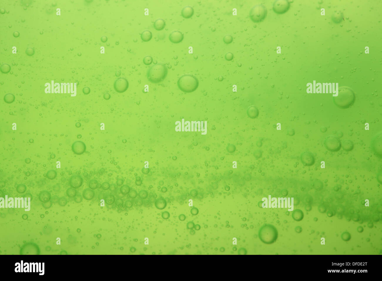 Green abstract blurred liquid background with soap bubbles Stock Photo ...