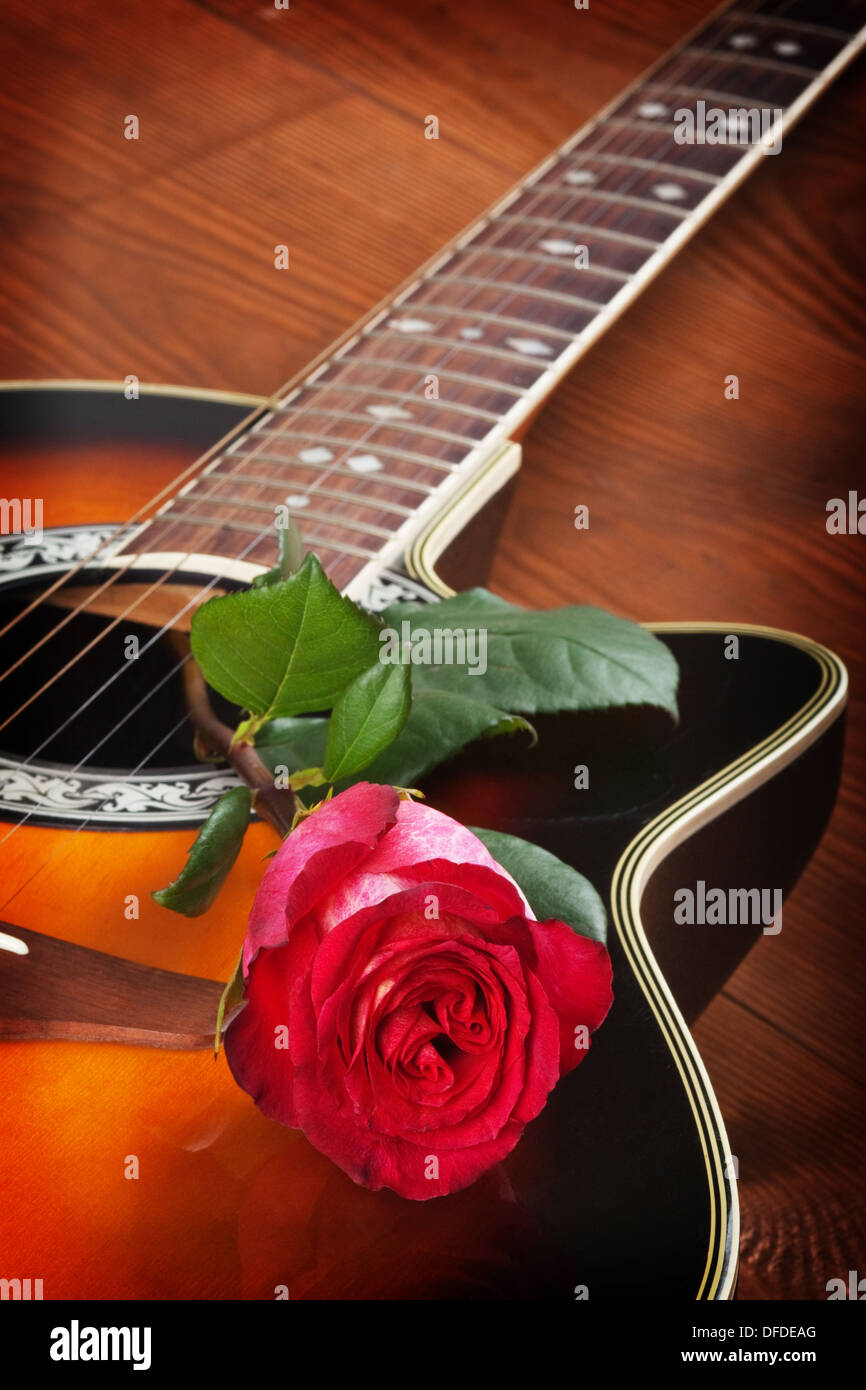 Acoustic guitar against an old barn background. Stock Photo