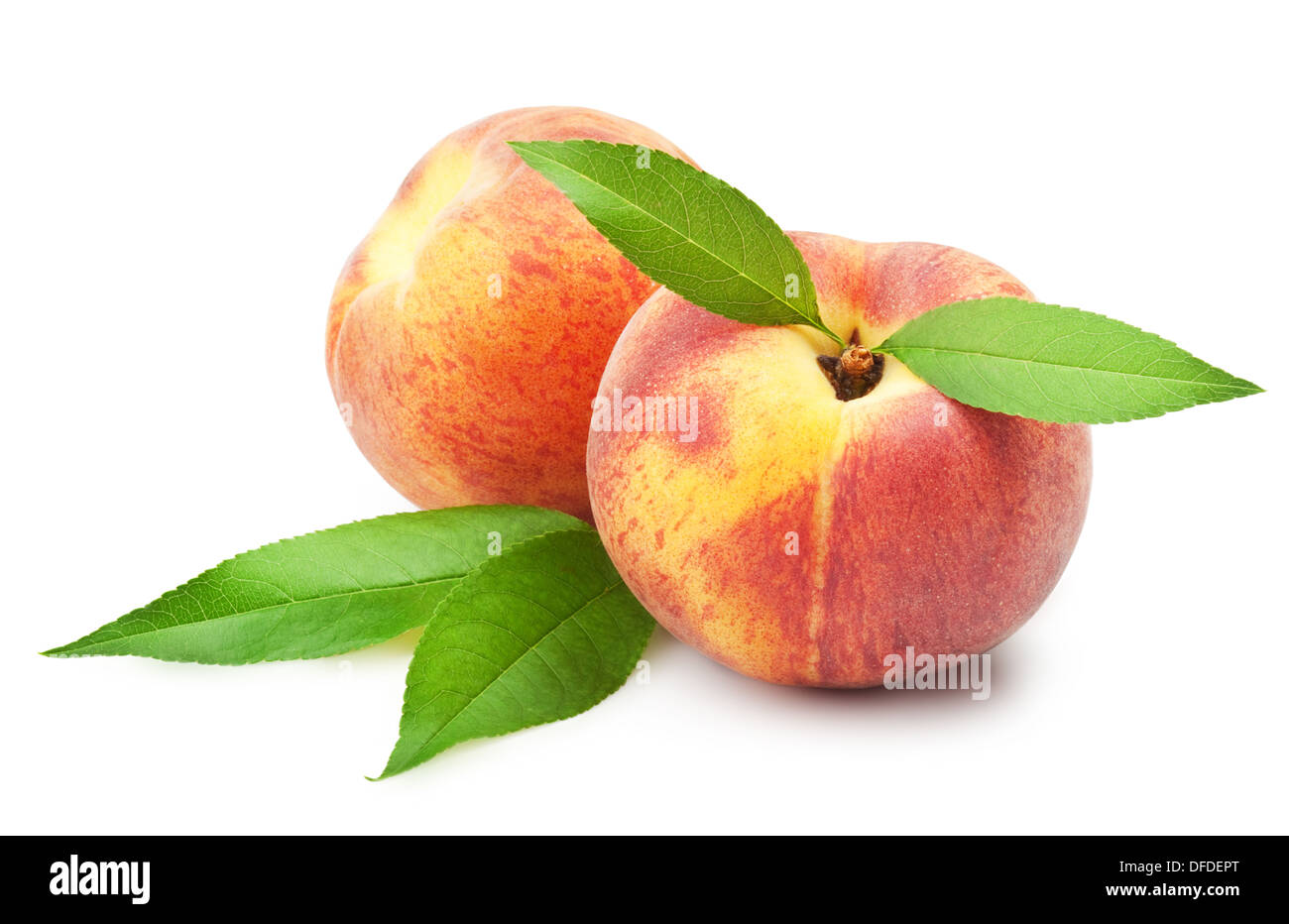 Ripe peach fruit with leaves on white background Stock Photo