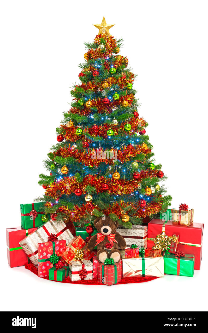 Christmas tree isolated on white with gift wrapped presents underneath Stock Photo