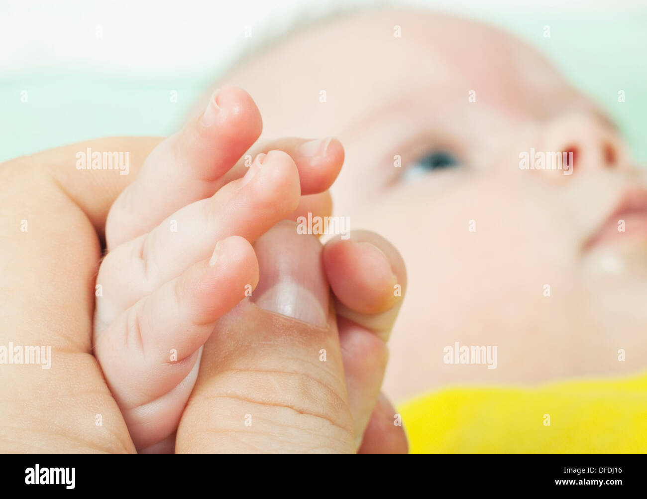 The hand of the child gently lays Stock Photo