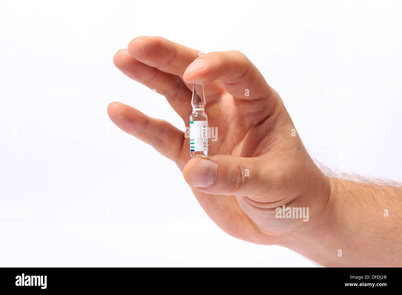 Ampoule in a hand isolated on white background. Ампула в руке, изолированно на белом фоне Stock Photo