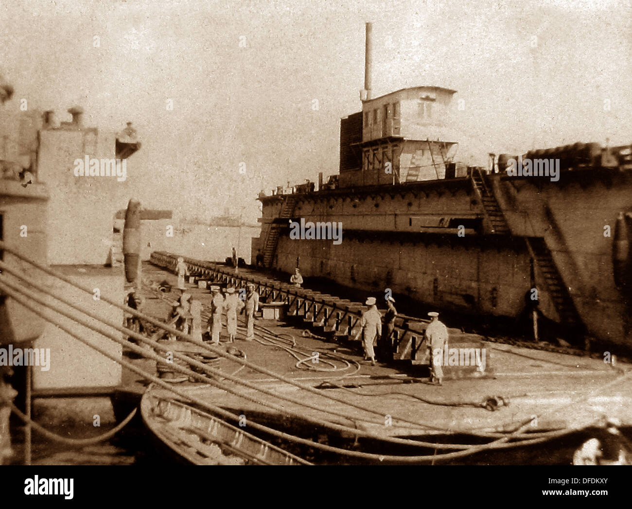 Egypt Port Said HMS Implacable alongside a captured German dry dock Stock Photo