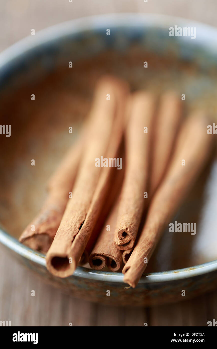 cinnamon sticks in a bowl Stock Photo