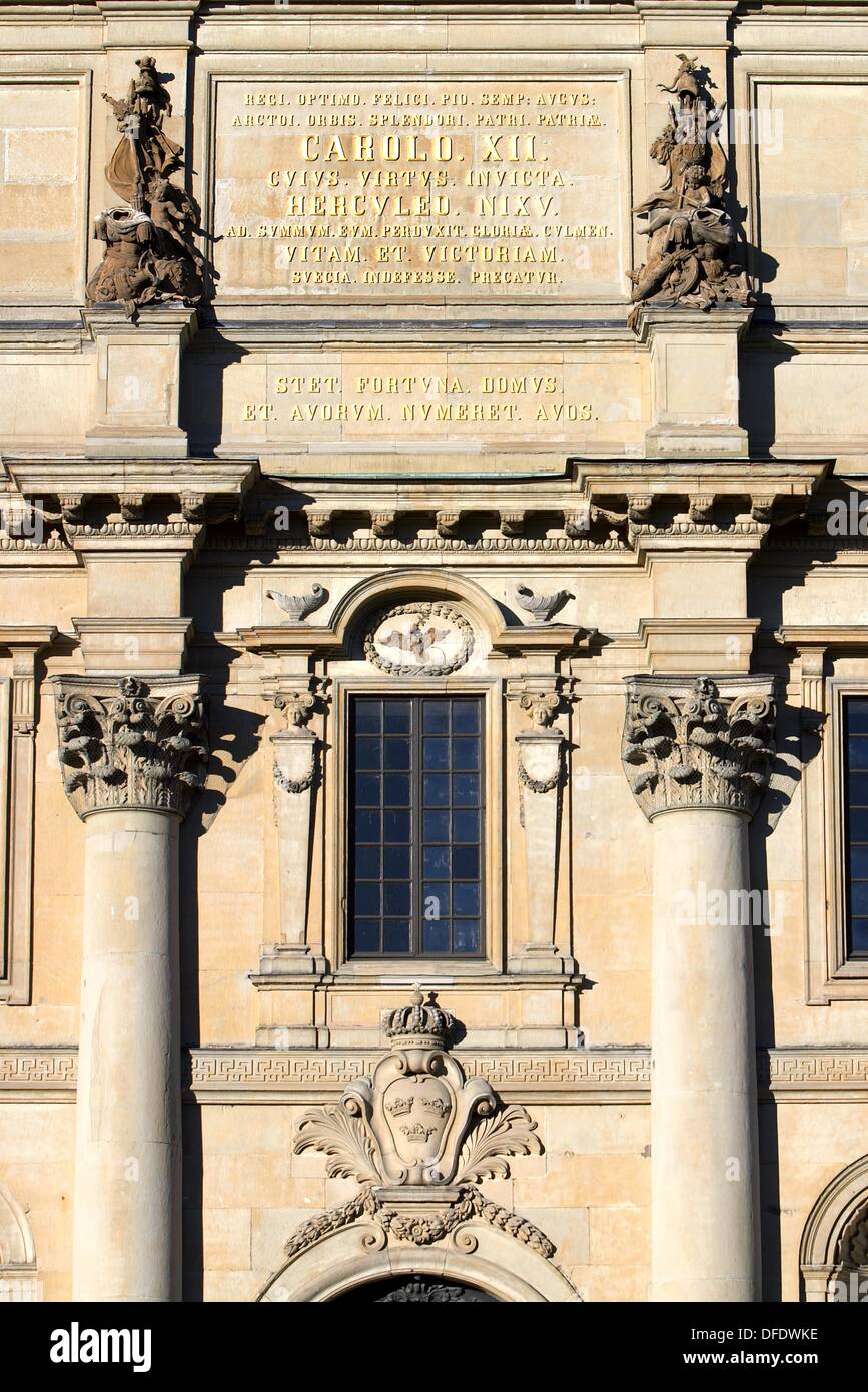 Royal palace facade with gold lettering and the three crowns found on the Swedish coat of arms in Stockhom Sweden Stock Photo