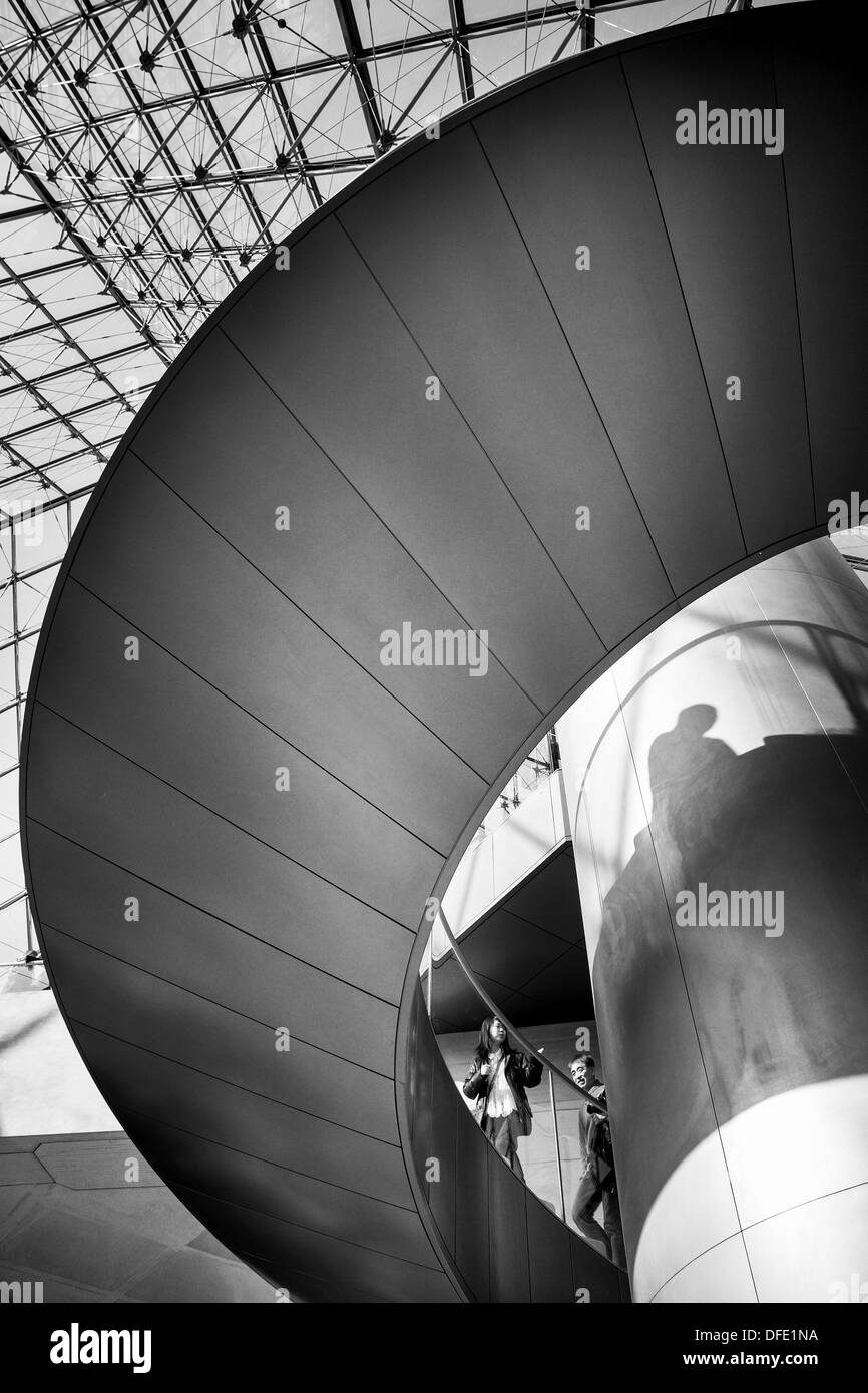 Stairs inside the Glass Pyramid of the Louvre Museum, Paris, France Stock Photo