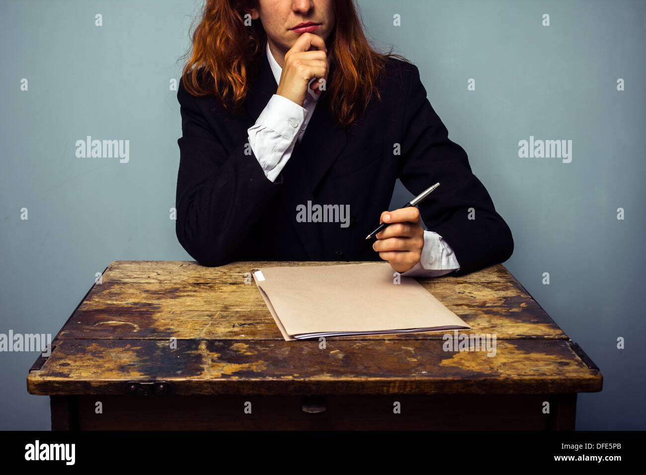 Woman thinking with pen pencil hi-res stock photography and images - Alamy
