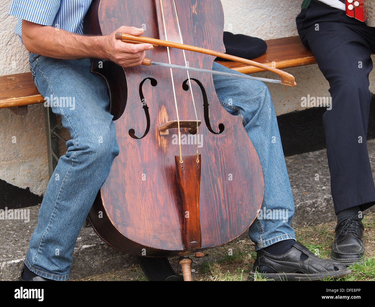 man playing very old contra bass Stock Photo