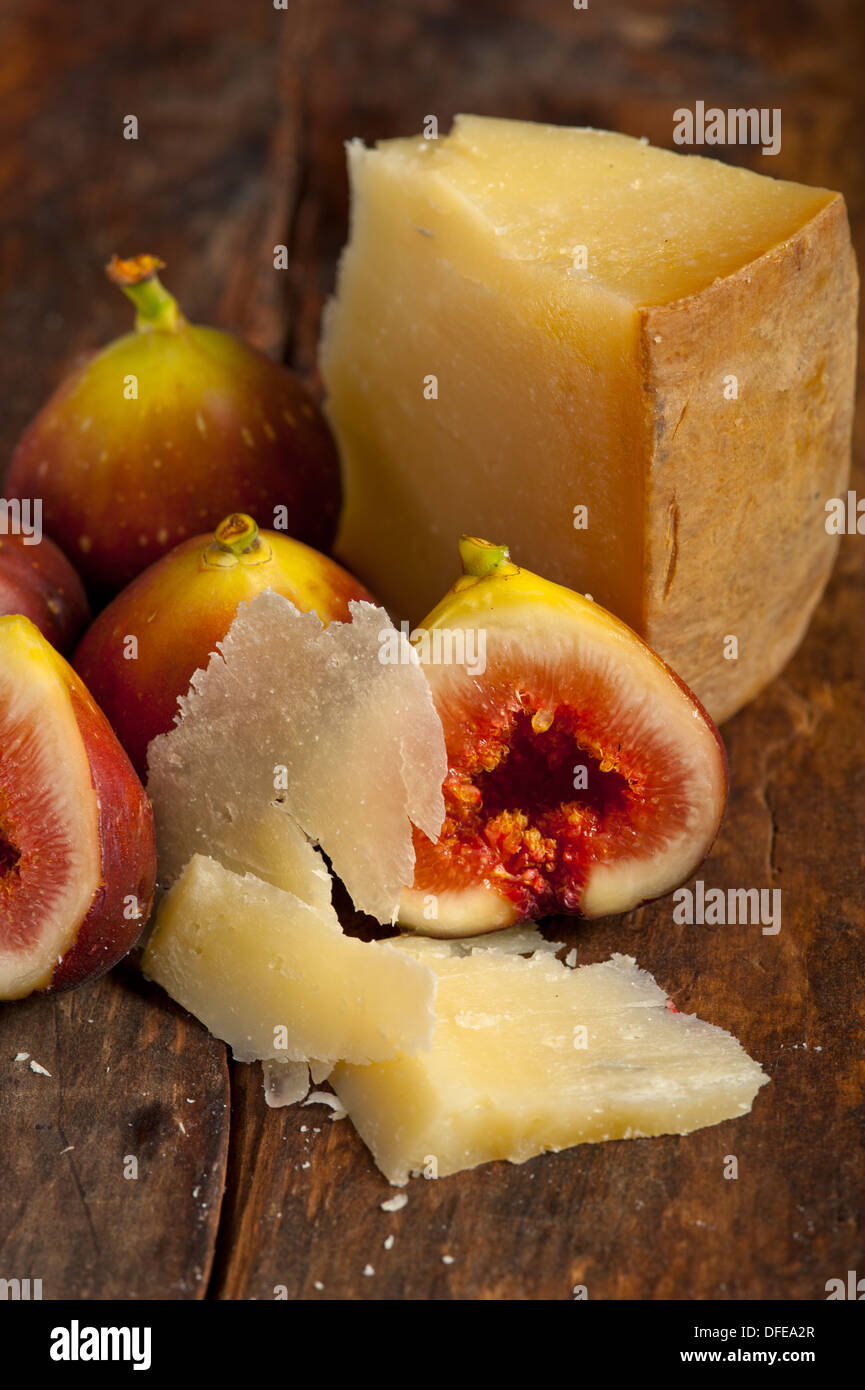 italian pecorino cheese and fresh figs macro closeup over old wood boards Stock Photo