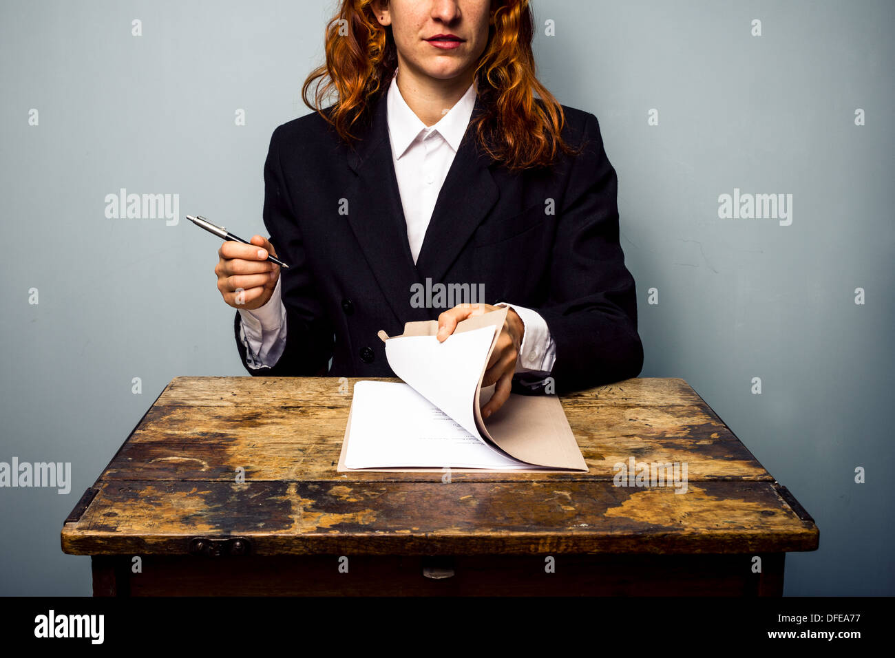 Young businesswoman is about to sign a contract Stock Photo