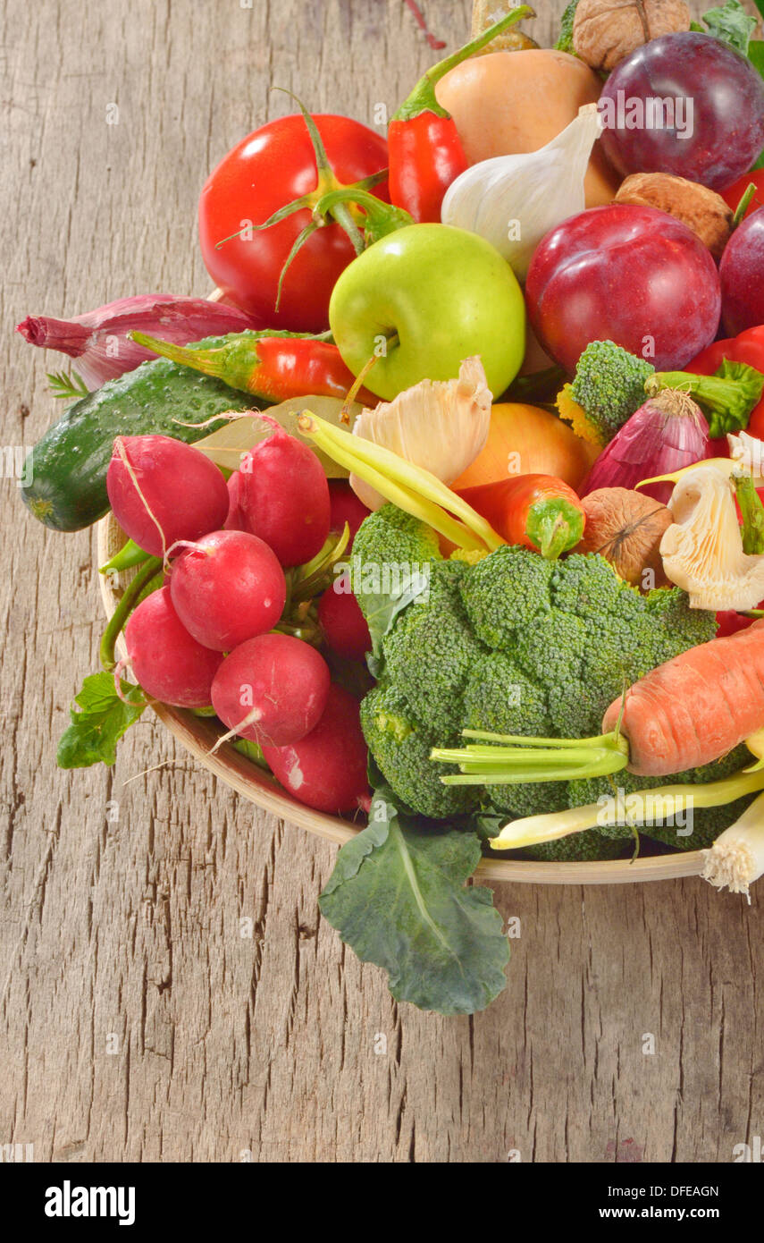 fresh fruits and vegetables on wooden table Stock Photo