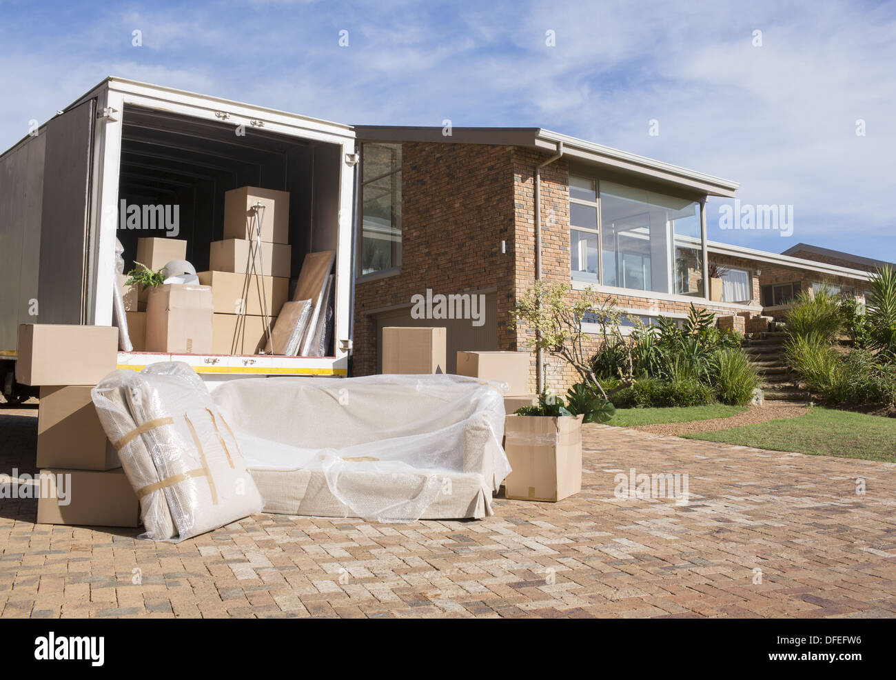 Moving van outside house Stock Photo Alamy
