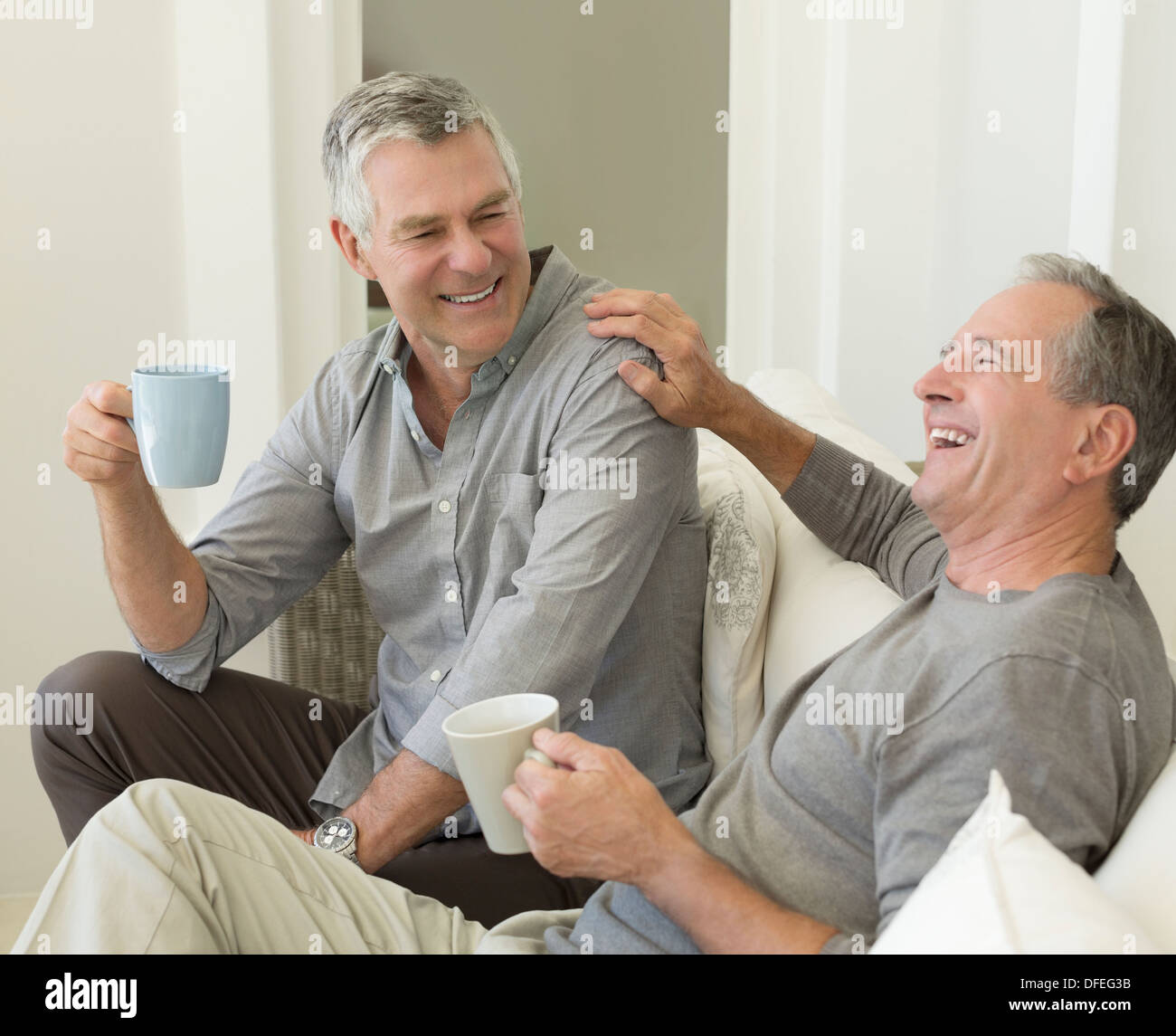 Senior men enjoying cup of coffee Stock Photo