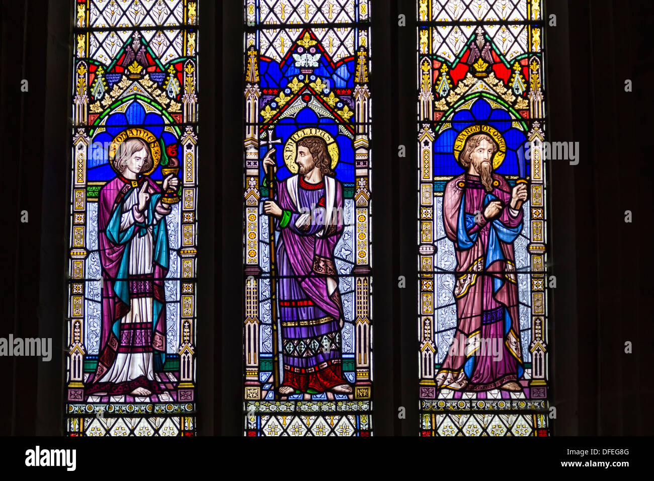 Stained glass window in St Mary Magdalene's Church, Battlefield, Shrewsbury, showing disciples John, Philip and Bartholomew. Stock Photo