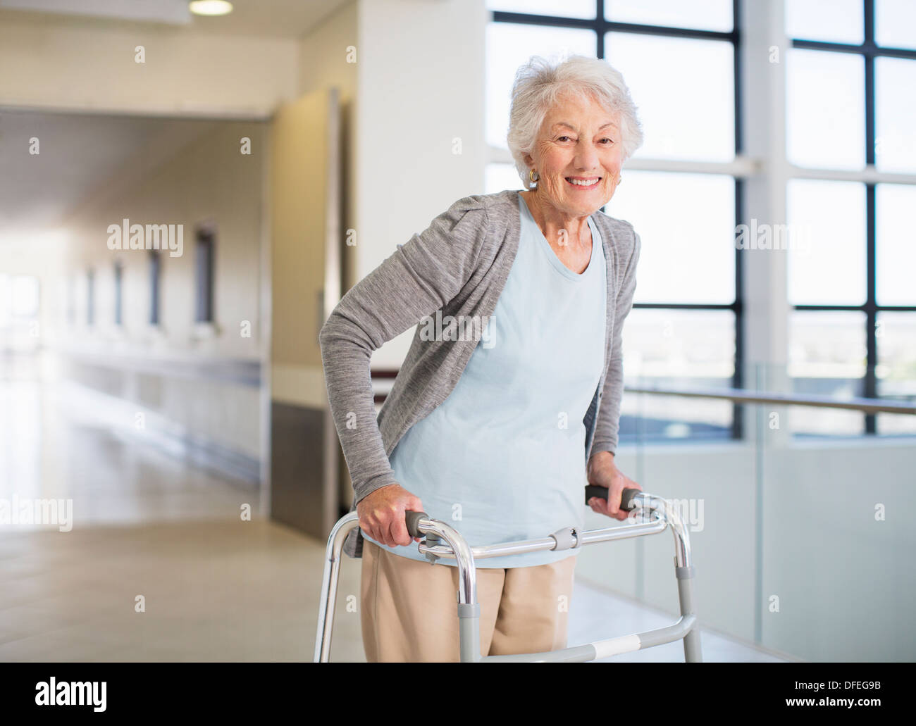 Senior patient using walker in hospital Stock Photo