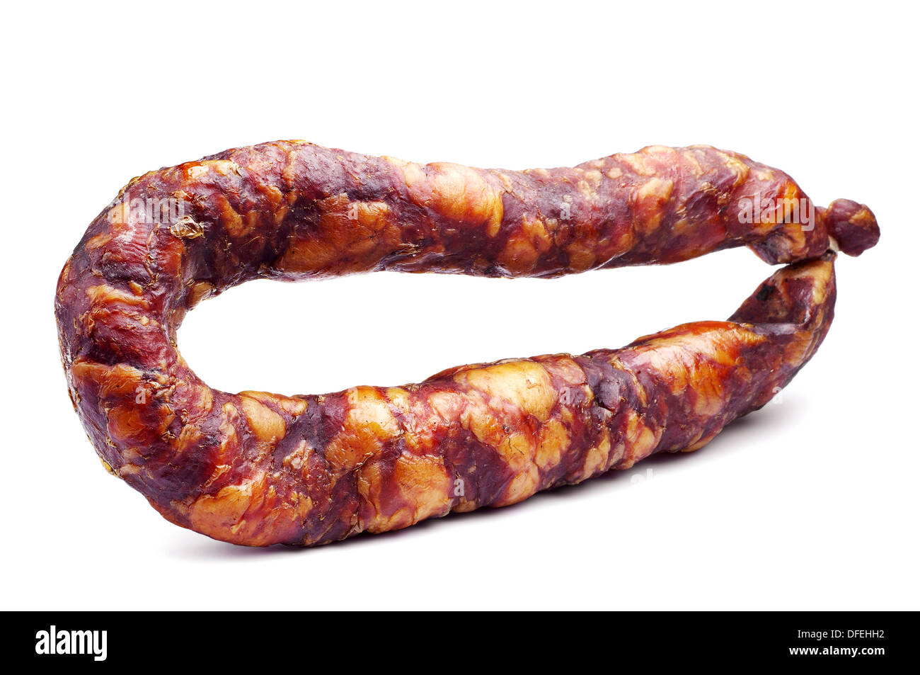 Thin smoked sausage on white Stock Photo