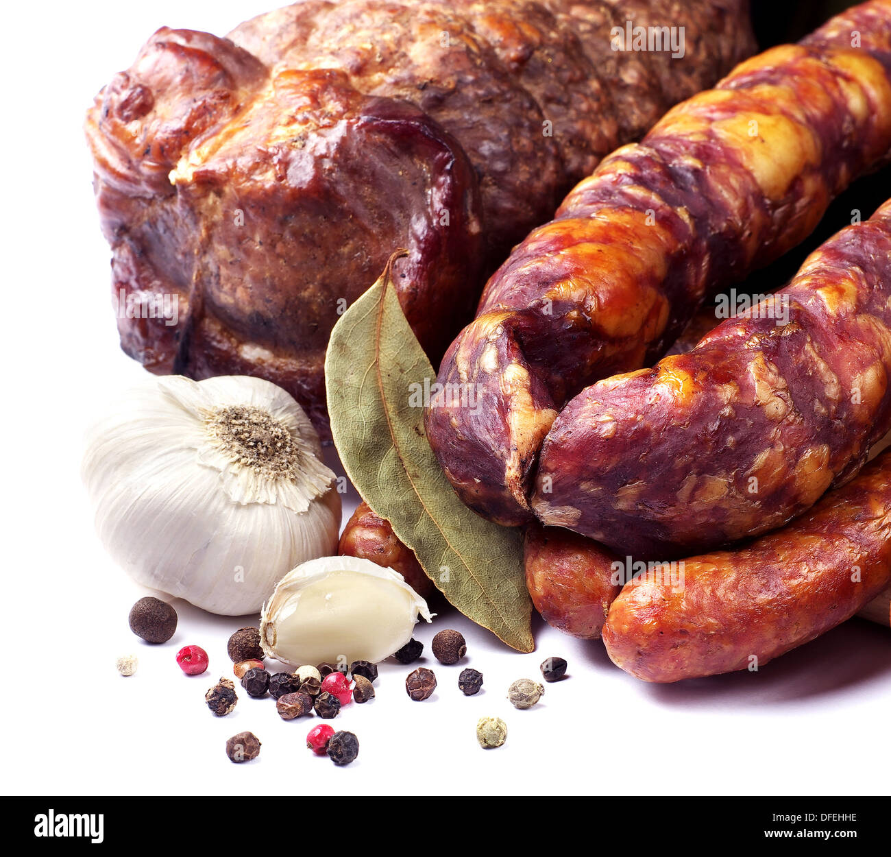 Smoked sausage and meat on white Stock Photo