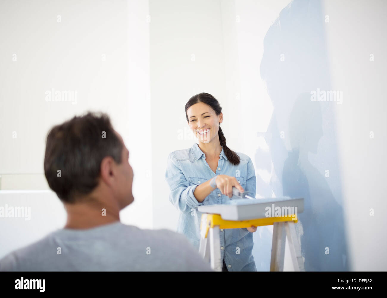Couple painting wall blue Stock Photo