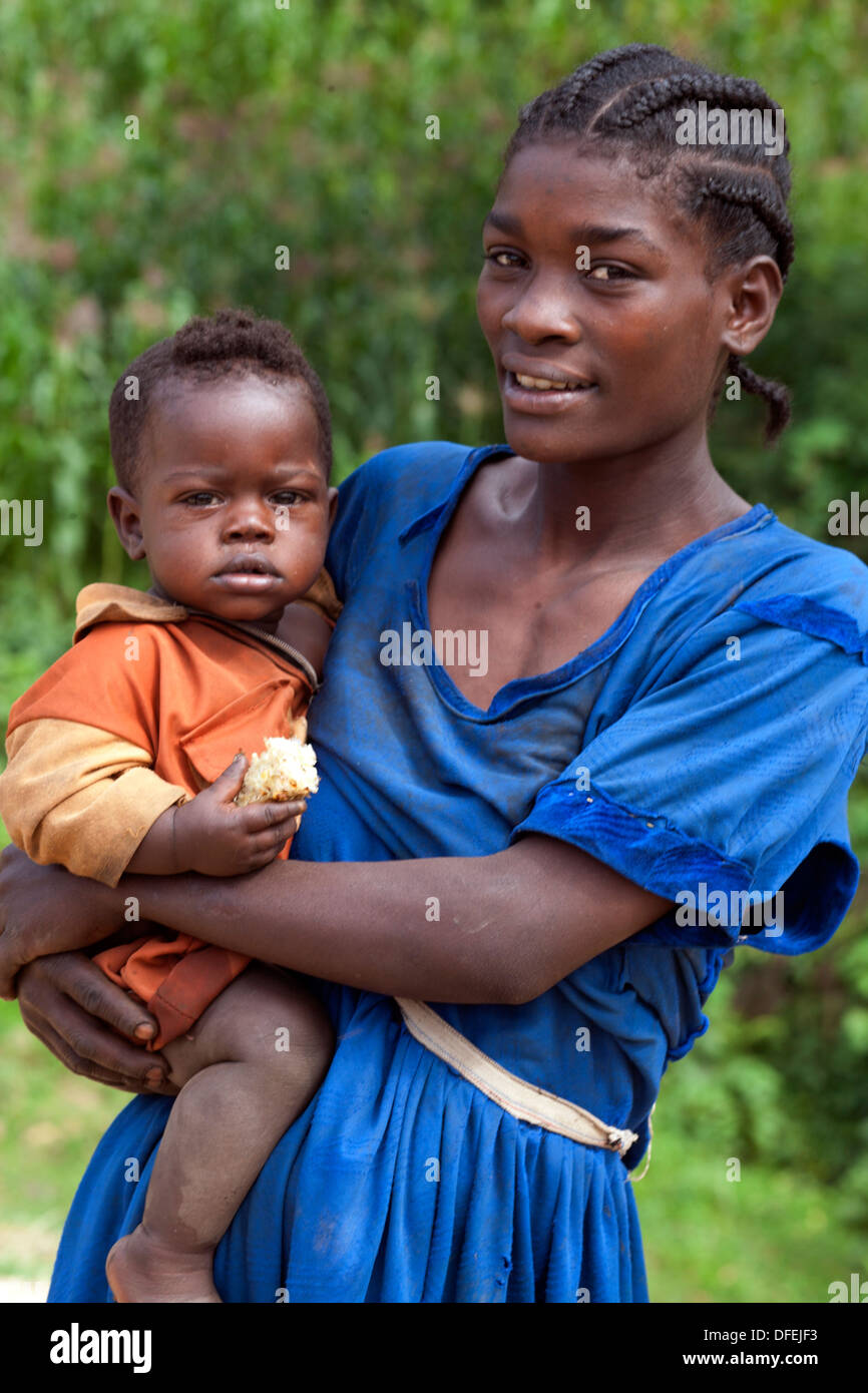Half body shot of young lady holding her baby daughter in the arm, Mizan Tefari, Ethiopia, East Africa. Stock Photo