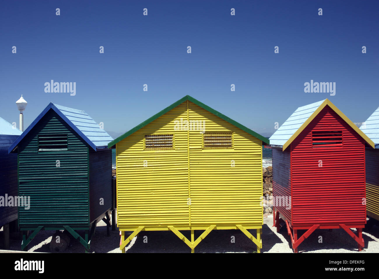 Colorful Beach Huts At The Sandy Beach Of St James With Blue Sky