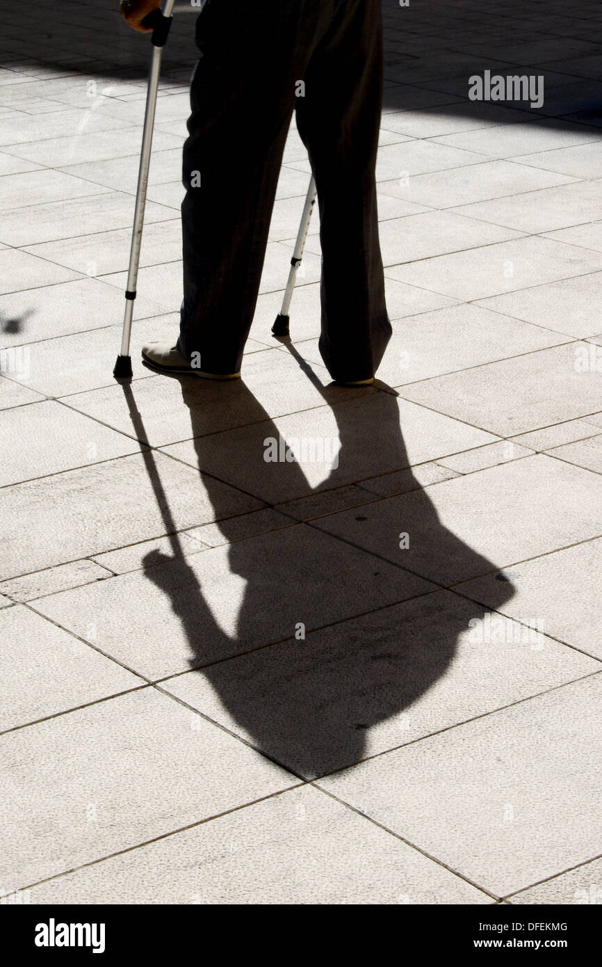 Crutches man shadow hi-res stock photography and images - Alamy