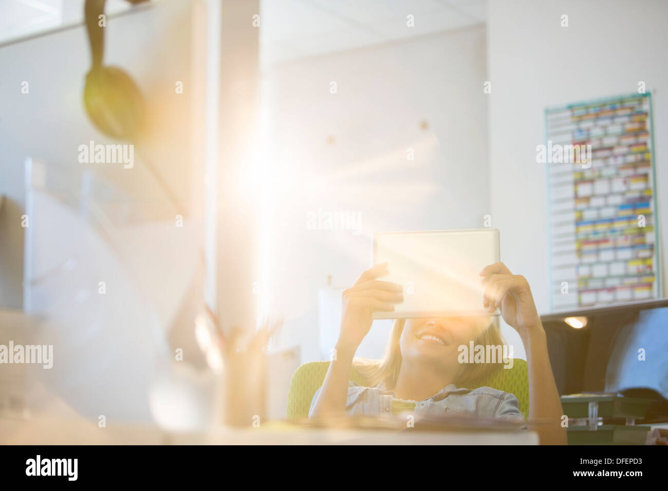 Businesswoman using digital tablet in office Stock Photo