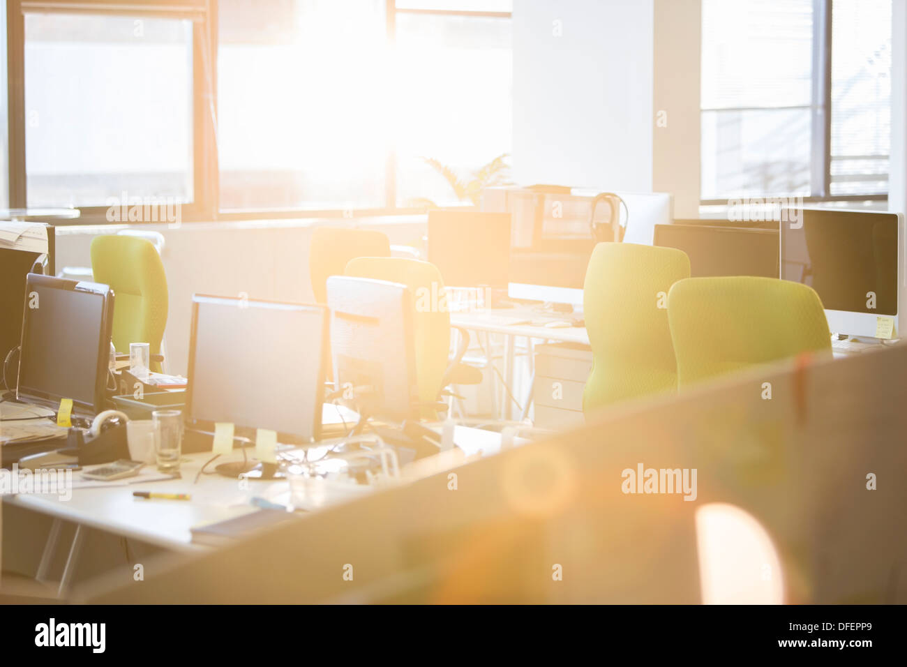 Sunlight streaming into empty office Stock Photo