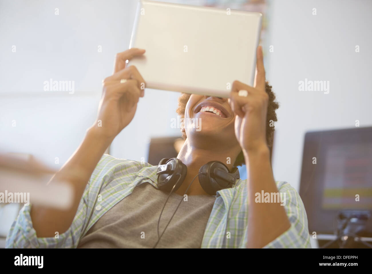 Businessman using digital tablet in office Stock Photo