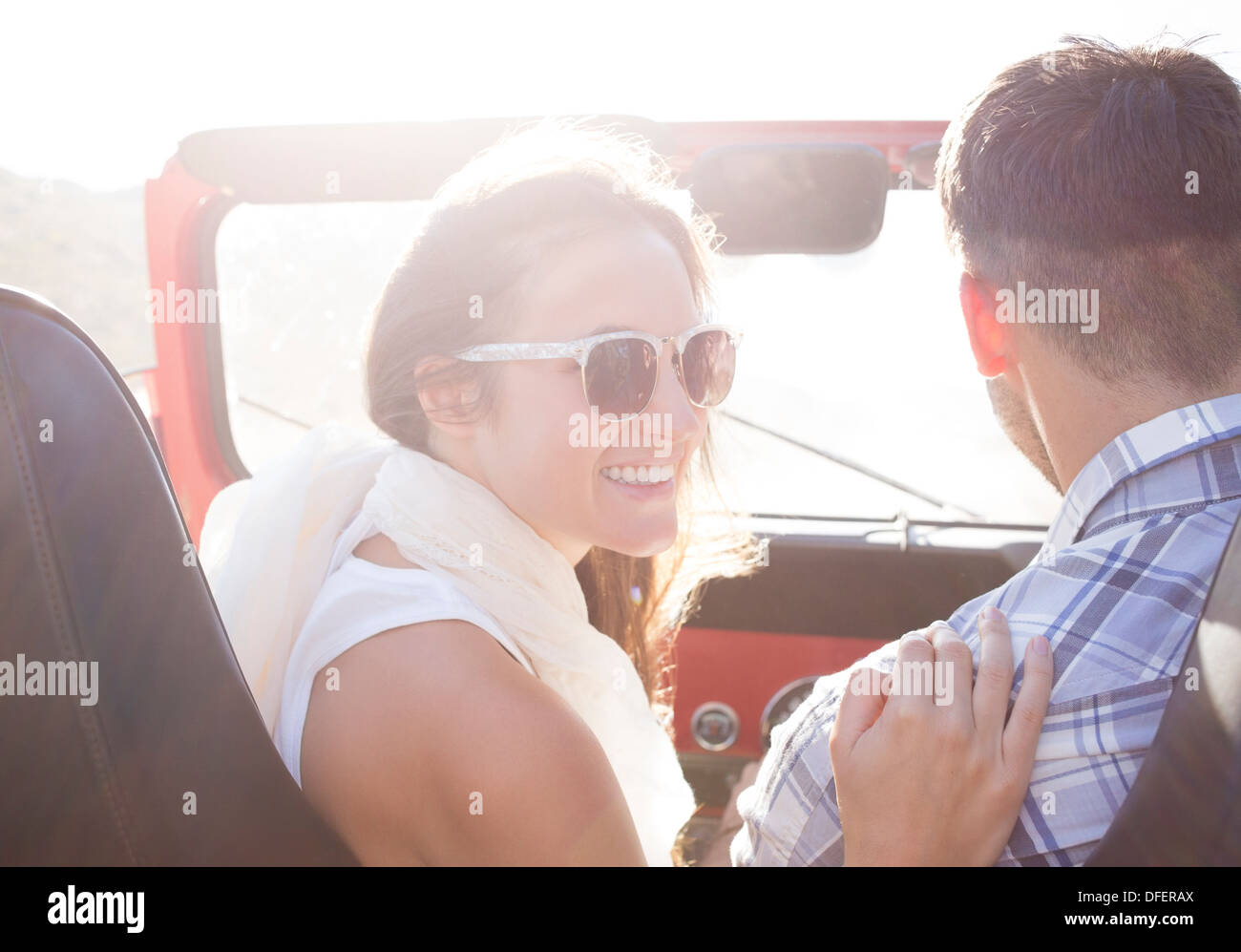 Couple in sport utility vehicle Stock Photo