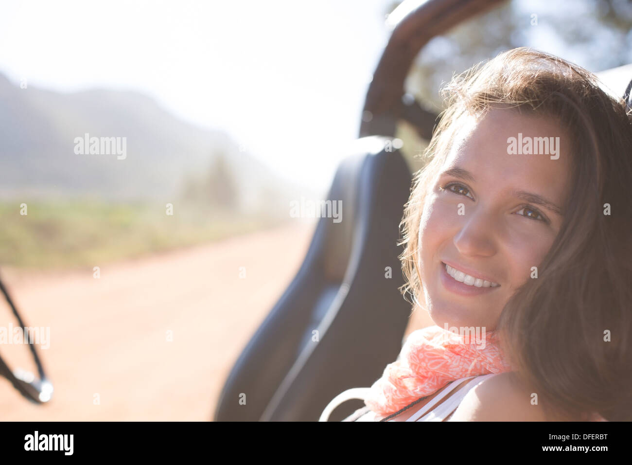 Woman relaxing in sport utility vehicle Stock Photo