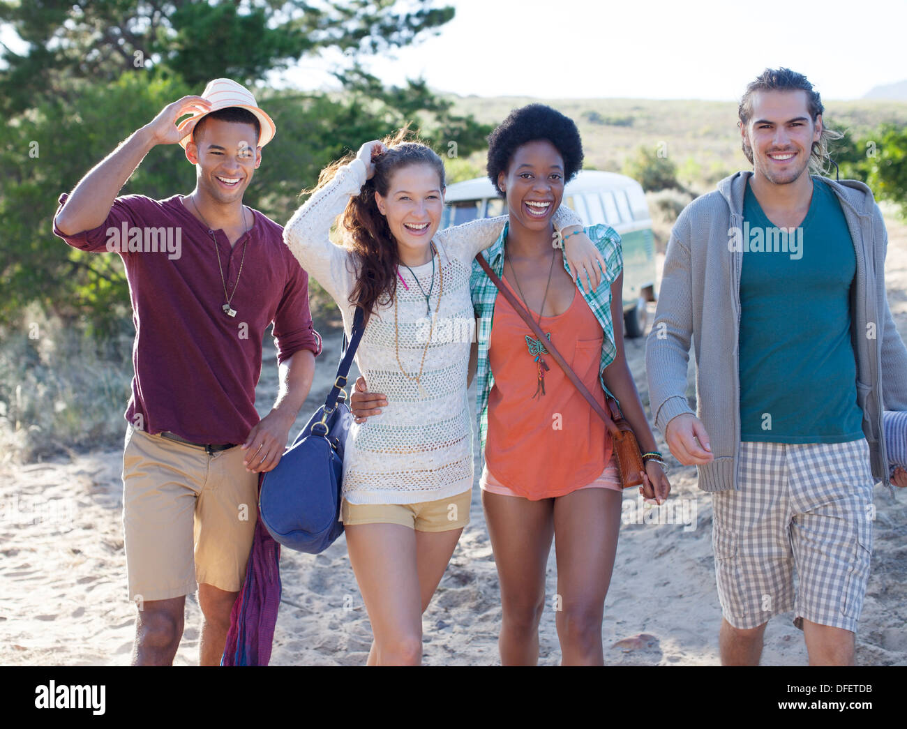 Friends walking on beach Stock Photo