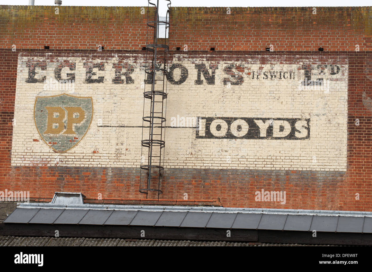 Advert painted on a brick wall Stock Photo