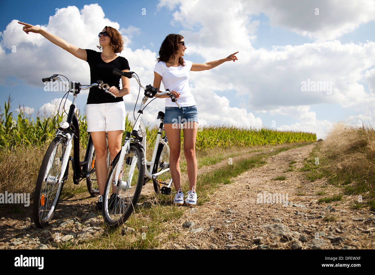 Girls on bike tour enjoying Stock Photo Alamy