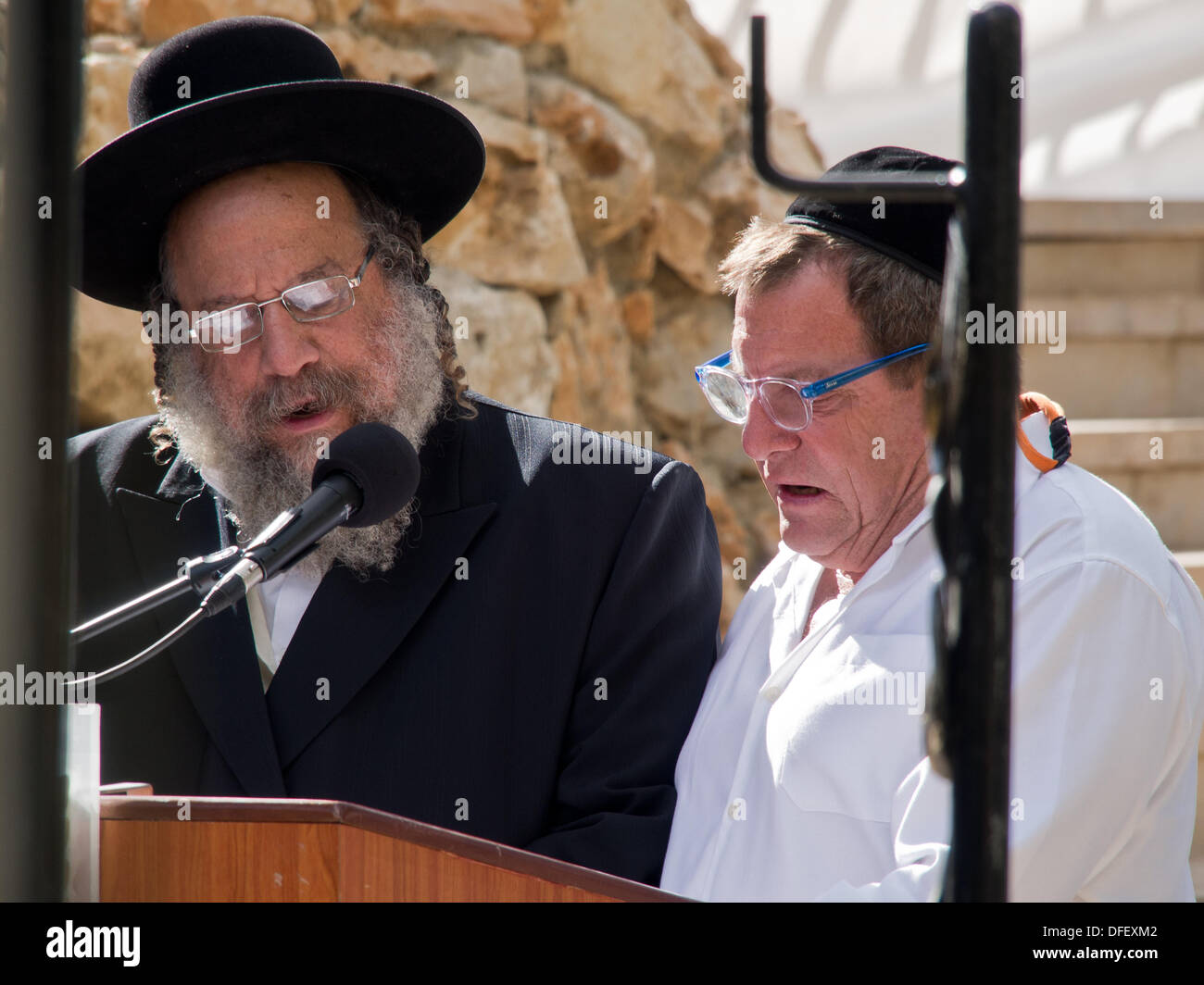 Jerusalem, Israel. 03rd Oct, 2013. Sons, PALMACH ZEEVI (R) and BENYAMIN ZEEVI (L) recite the Kadish prayer at a memorial ceremony for their father, Rehavam 'Gandhi' Zeevi. Jerusalem, Israel. 3-Oct-2013.  Ceremony at Mt. Herzl Military Cemetery honors Rehavam 'Gandhi' Zeevi, former military general, MK and Minister, assassinated October 17th, 2001 at the Jerusalem Hyatt Hotel by Hamdi Quran of the Popular Front for the Liberation of Palestine. Credit:  Nir Alon/Alamy Live News Stock Photo