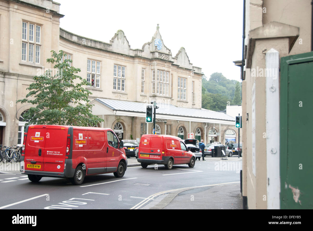 Royal Mail cars driving on green light- postal business network Stock Photo