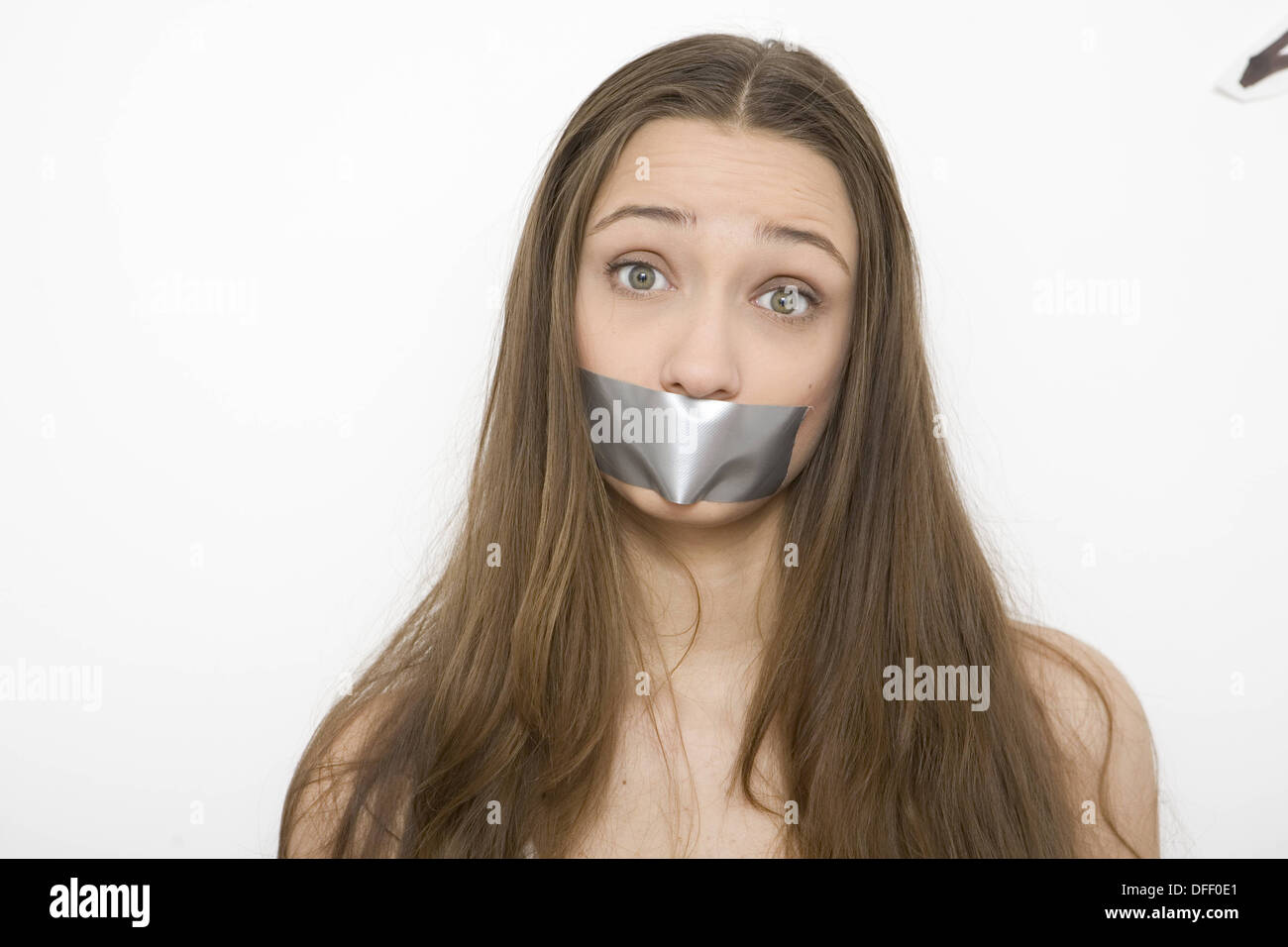 Woman with Tape Over Mouth Stock Photo Alamy