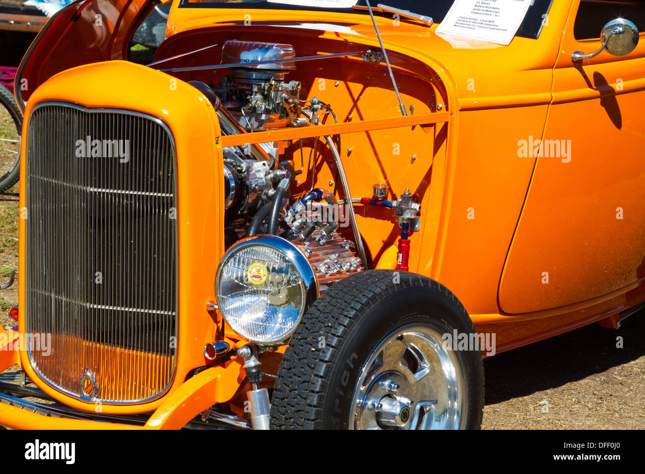 A beautiful bright orange 1932 Ford hot-rod showing engine detail. Stock Photo