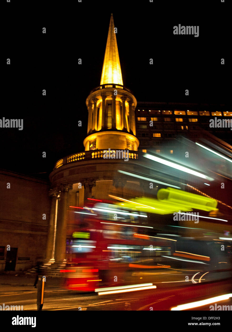 Double-decker buses in transit showing All Souls Church at night, Langham Place, London, England, United Kingdom Stock Photo