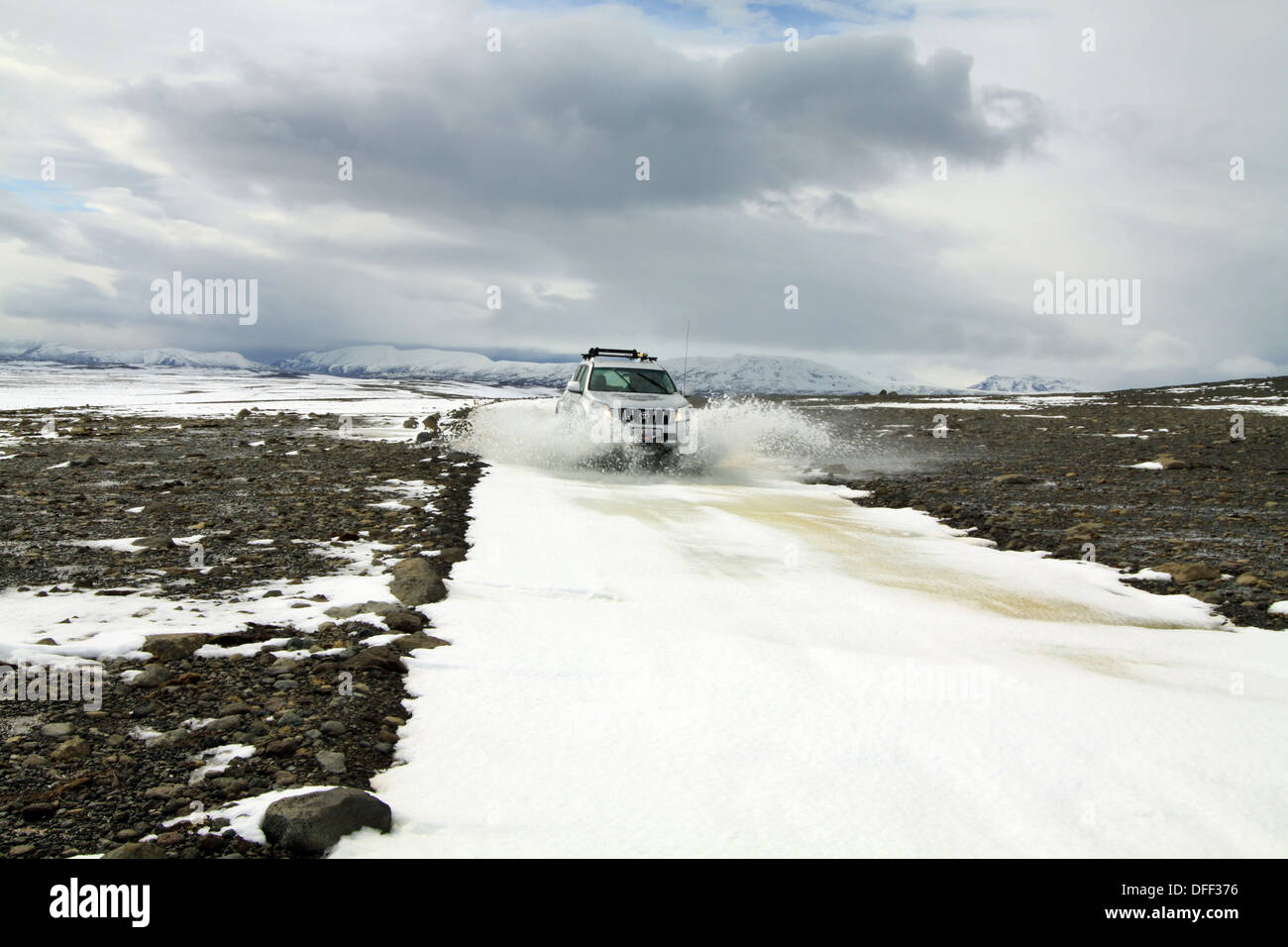 Highly modified Toyota Landcruiser driving in snow, Iceland Stock Photo