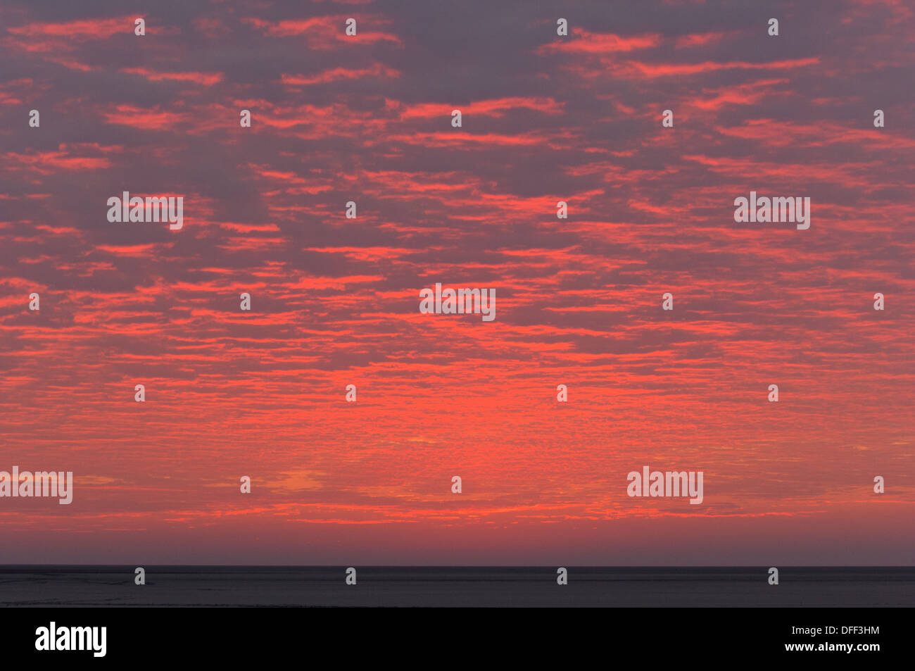 Clouds in the sky glowing red at sunset, from the Kubu Island (Lekhubu), Makgadikgadi Pan, Botswana Stock Photo