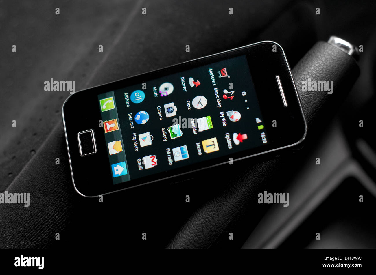 android smartphone laying on car seat Stock Photo