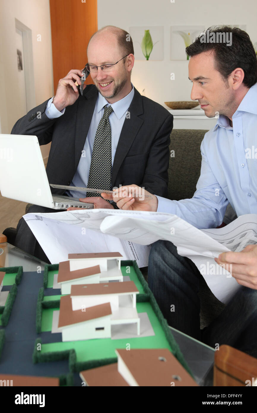 Two architect rushing to complete on time Stock Photo