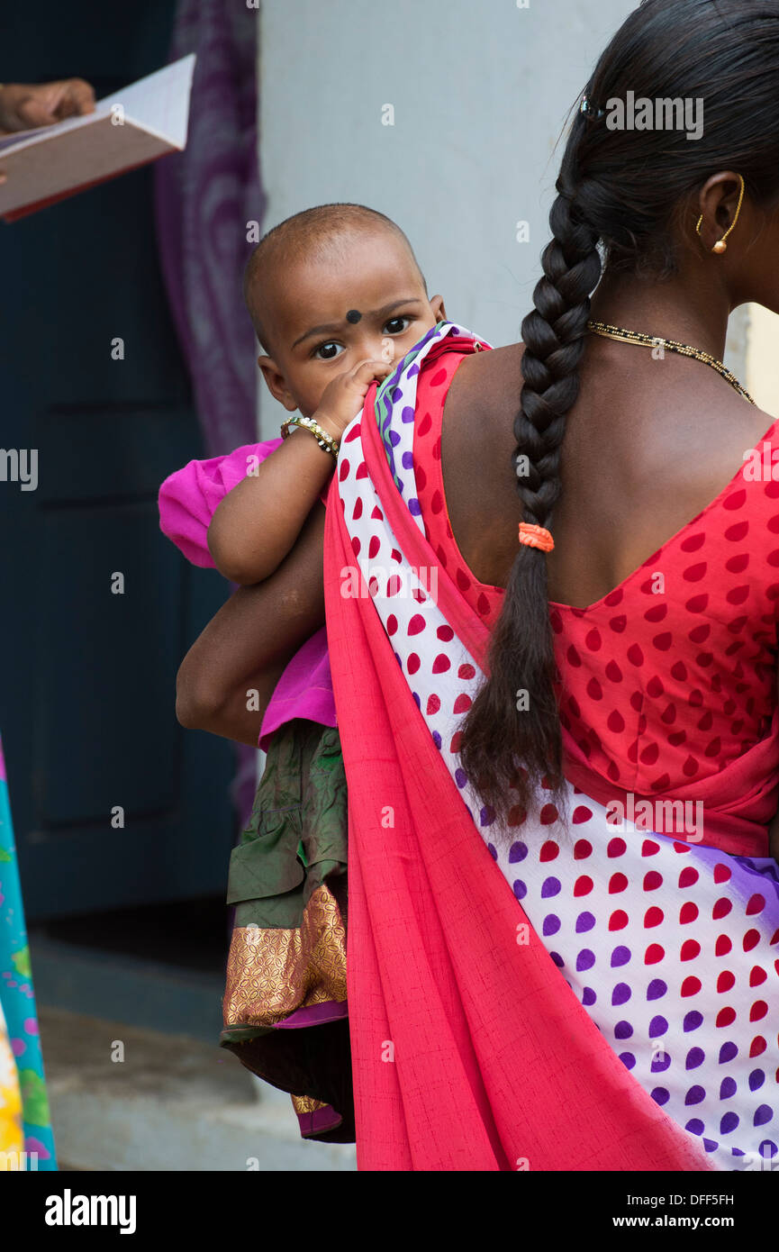 Indian woman carrying baby hi-res stock photography and images - Alamy
