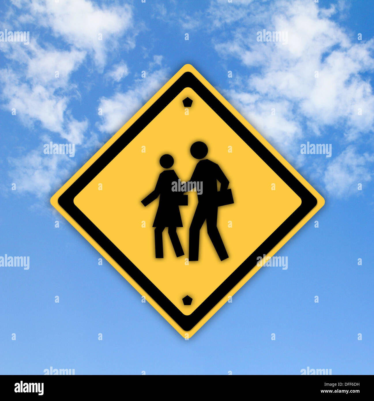 School warning sign on yellow with a blue sky background Stock Photo