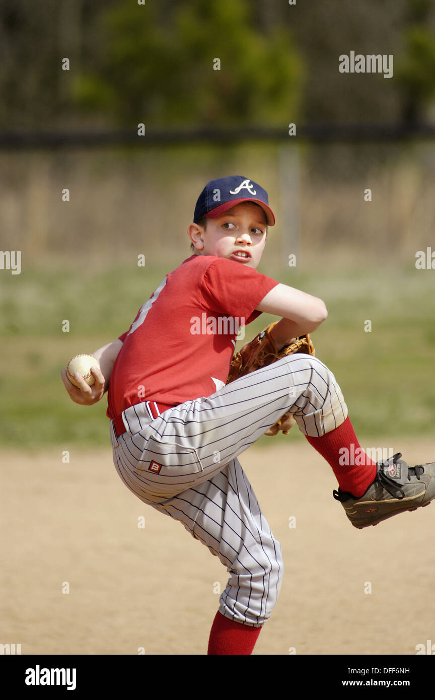 Little league baseball game, with full safety gear, all boys aged from